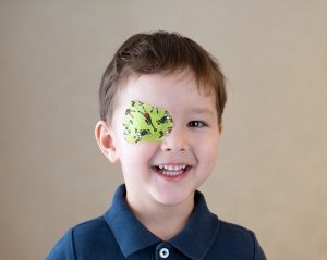 Eye patch. Portrait of a boy. Ophthalmology.
