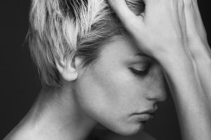 Depression. young attractive woman with an awful migraine